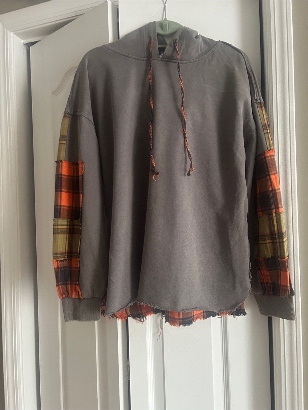 Woman’s Gray Hoodie with Orange Plaid Sleeve Accents